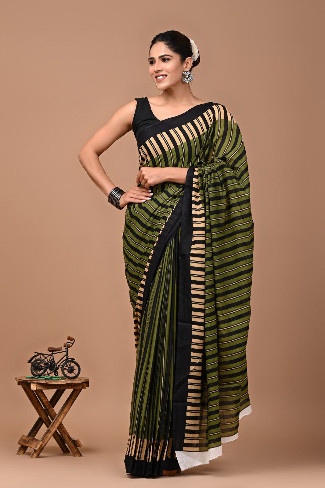 Sleek Pine Green Mulcotton Saree with Modern Black Line Prints