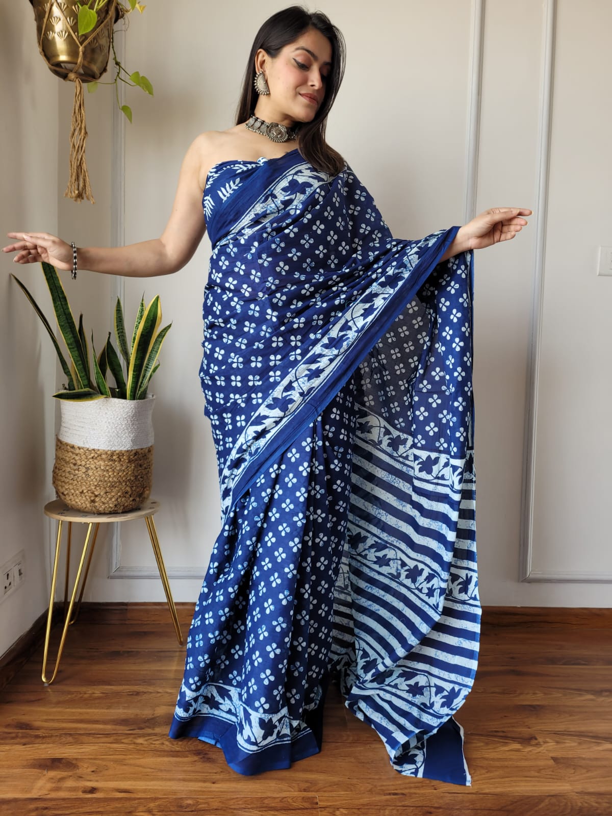 Caption: Elegant Bloom: Blue Mulcotton Saree with White Floral Prints