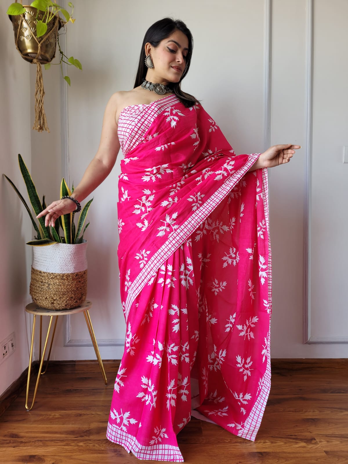 Caption: Serene Style: Pink Mulcotton Saree with Tree Leaf Prints