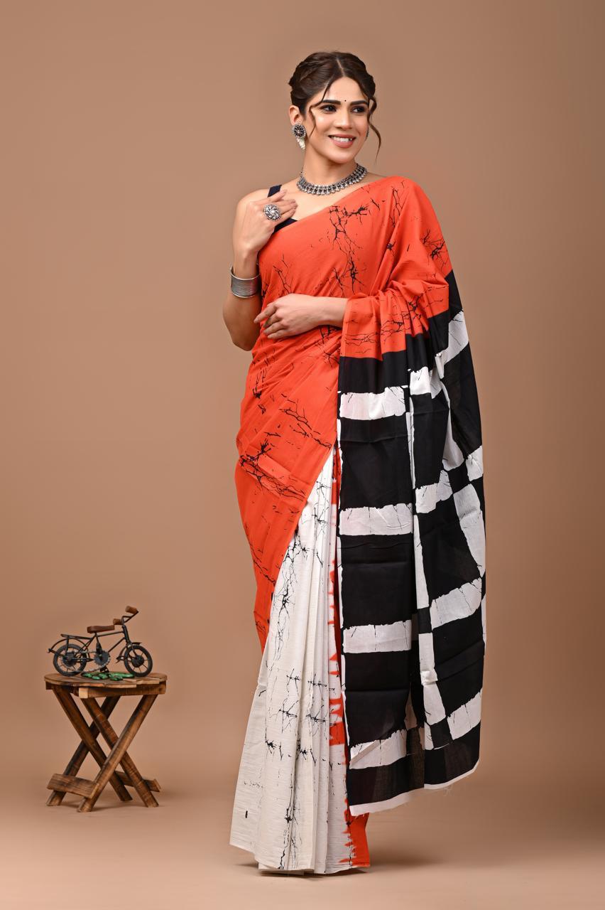 Radiant Charm: Orange Mulcotton Saree with Batik Patterns