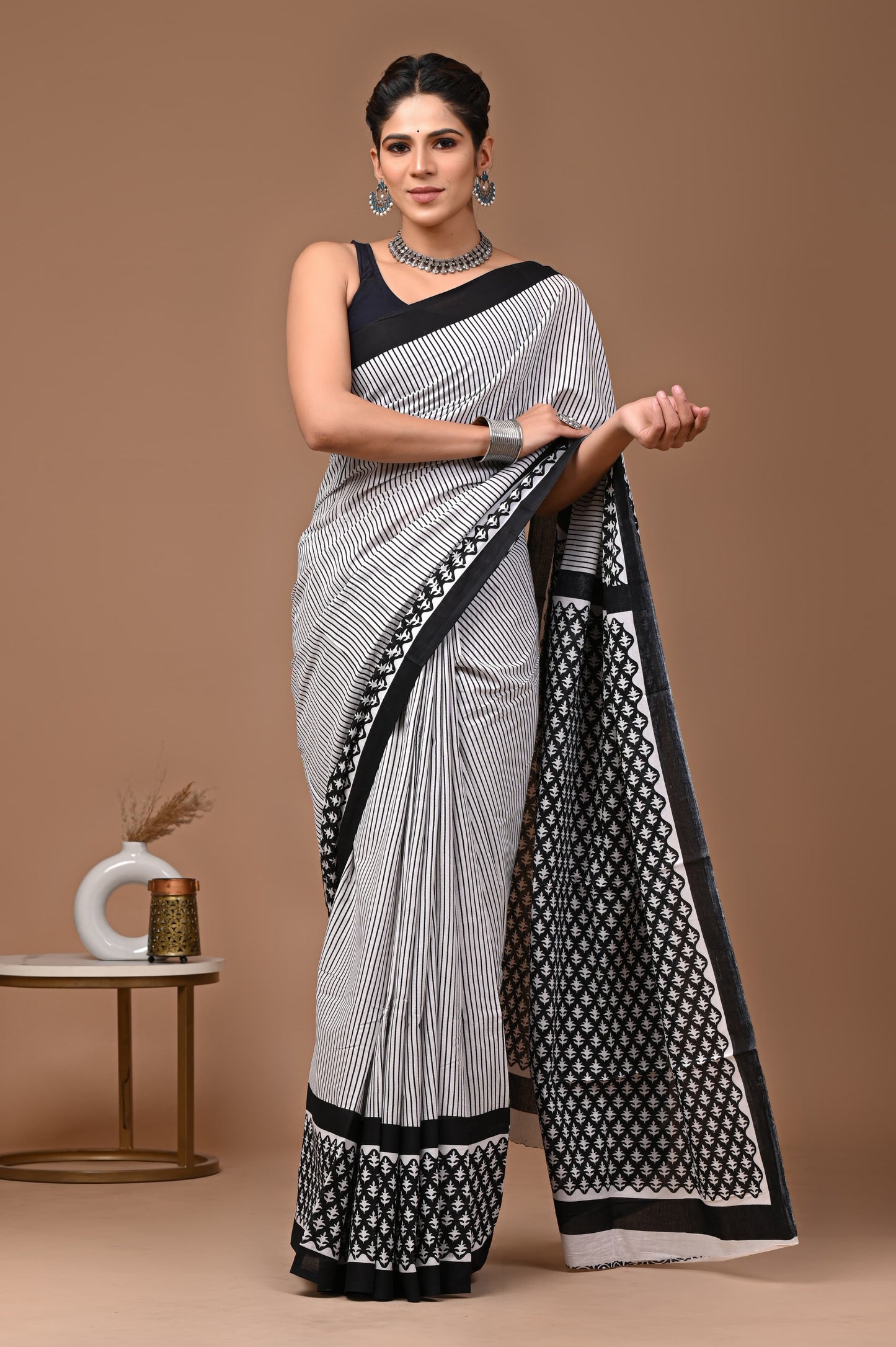 Soothing Waves: White Mulcotton Saree with Blue and Brown Patterns